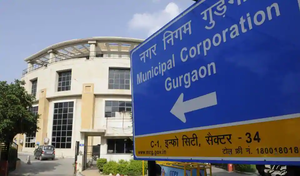 Residential and commercial buildings in Gurugram affected by enforcement against illegal paying-guest operations and zoning violations.