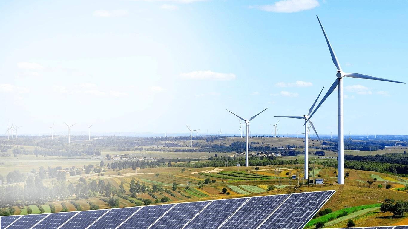 Solar photovoltaic panels installed beside inverter equipment in a utility-scale renewable power setting