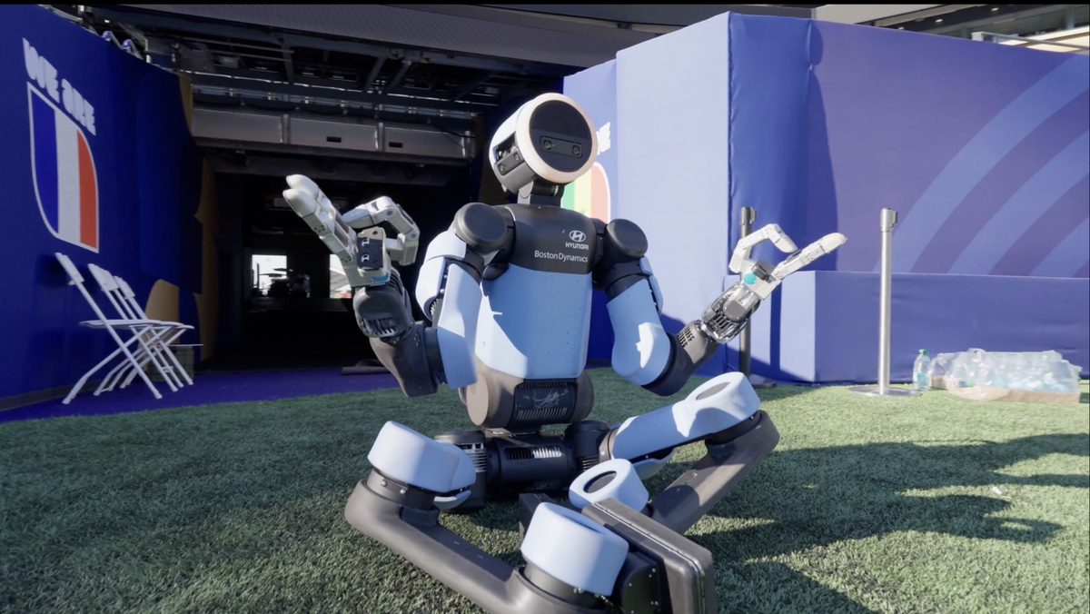 Quadruped inspection robot in an industrial setting with sensor arrays and a control platform nearby