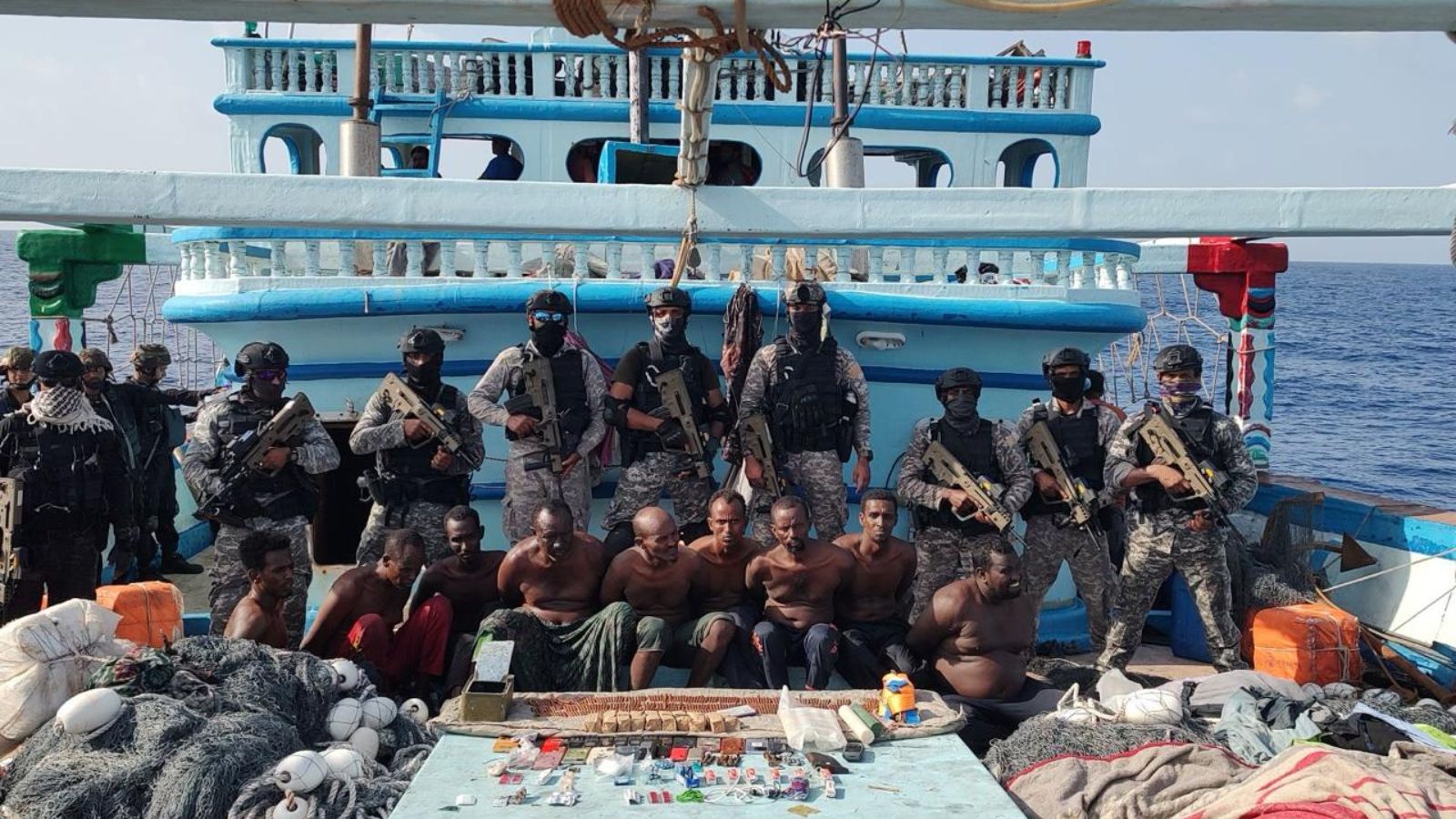 Courthouse and cargo ship imagery for a maritime piracy case under Indian law