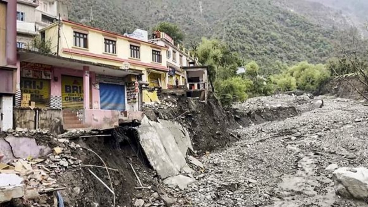 Damaged mountain road with debris after flash floods in a Himalayan valley