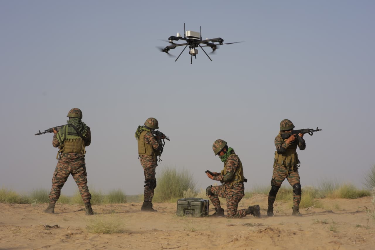 A military drone and a command board representing drone-warfare coordination problems