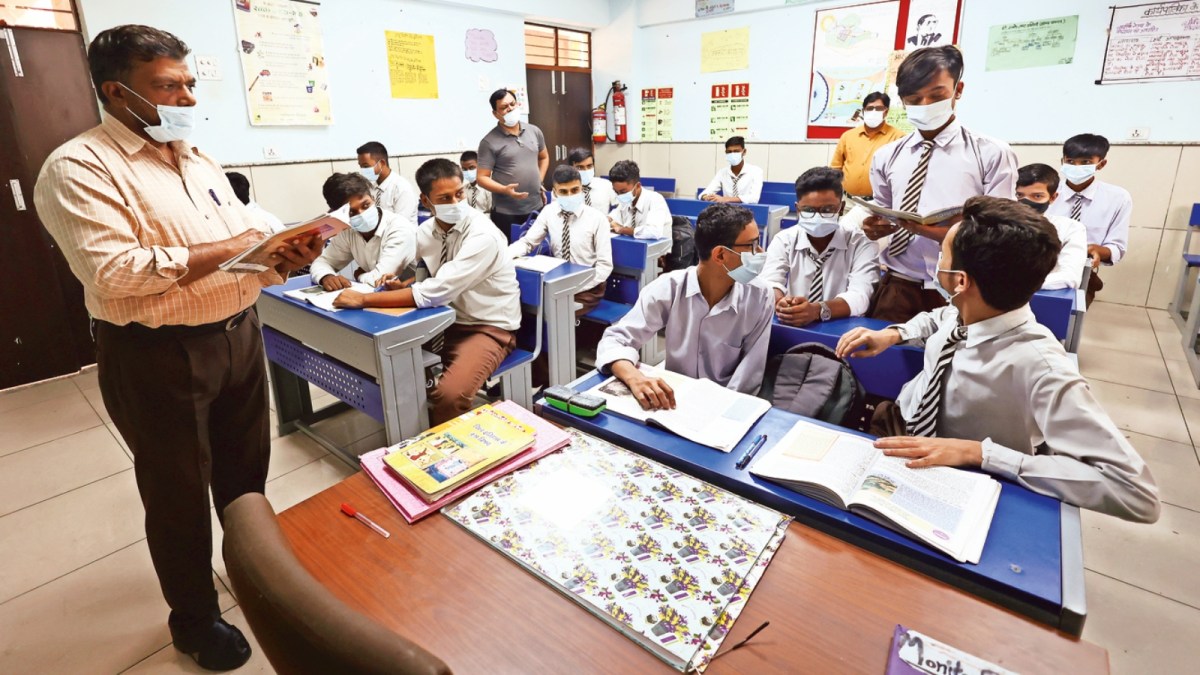 An Industrial Training Institute workshop with modern tools, training benches, and a digital control panel in an uncluttered classroom setting.