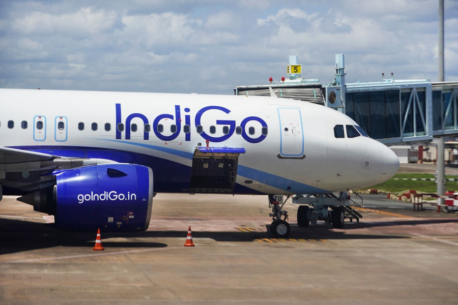 Illustration of an airport terminal, a passenger aircraft, and a corporate office building representing airline ownership and airport control.